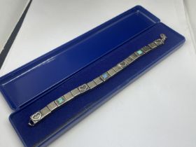 A SILVER AND MOTHER OF PEARL BRACELET IN A PRESENTATION BOX