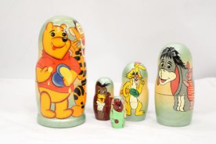 A WINNE THE POOH AND PALS RUSSIAN DOLL - APPROXIMATELY 18CM HIGH
