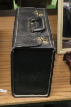 A VINTAGE BLACK BRIEFCASE