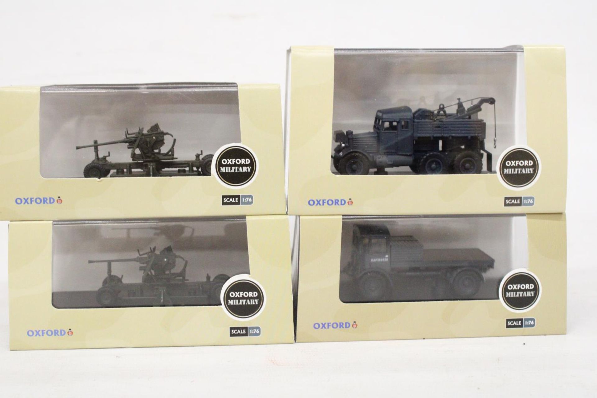 FOUR AS NEW AND BOXED OXFORD MILITARY VEHICLES