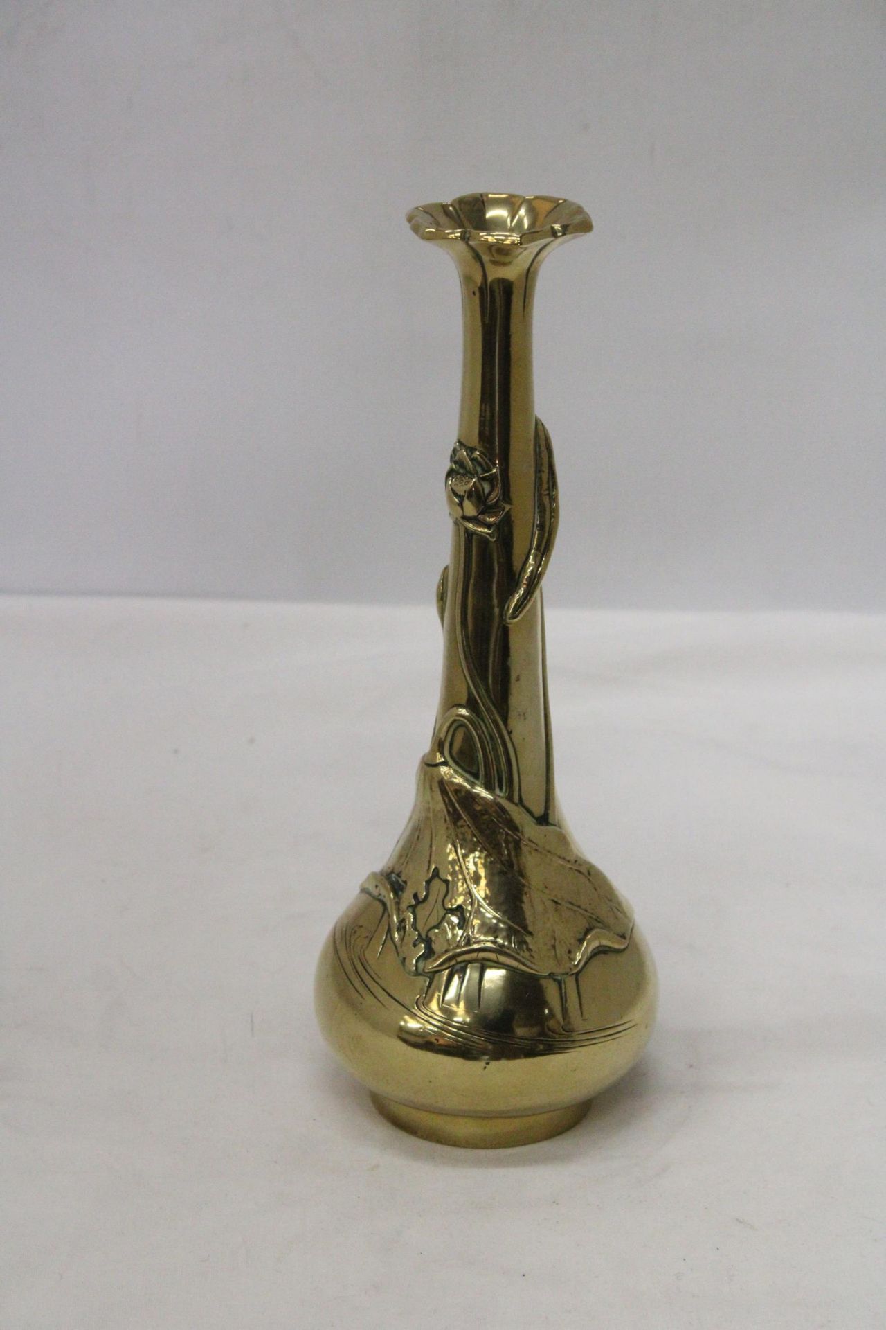 AN ORIENTAL BRASS ART NOUVEAU LONG NECKED VASE MARKED TO THE BASE
