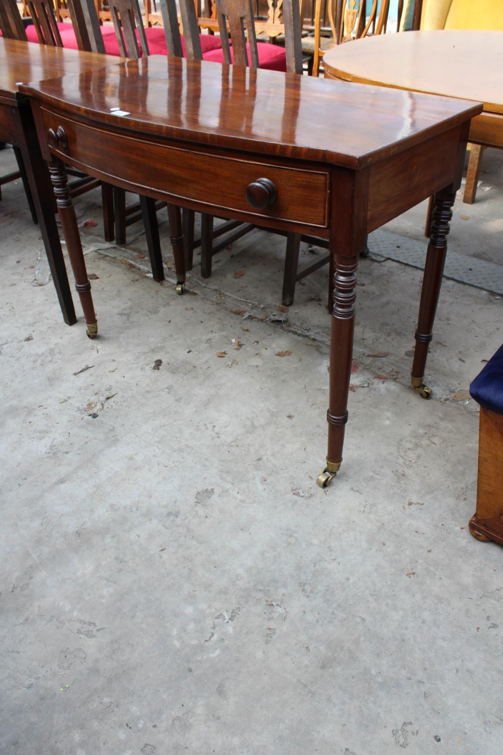 A 19TH CENTURY MAHOGANY BOW-FRONTED SIDE-TABLE WITH SINGLE DRAWER ON TURNED LEGS, 39.5" WIDE - Image 2 of 5