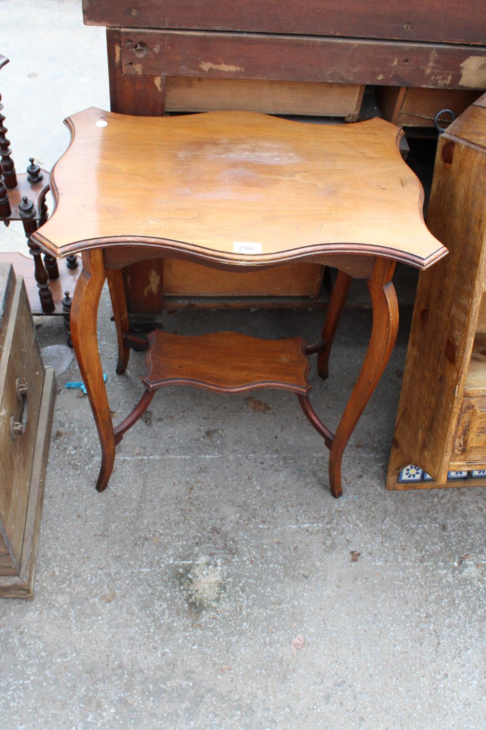 AN EDWARDIAN MAHOGANY TWO TIER CENTRE TABLE, 23" X 16"