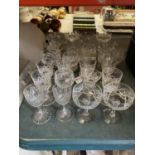 A QUANTITY OF CUT GLASSES TO INCLUDE SHERRY, COCKTAIL, TUMBLERS, PORT, ETC