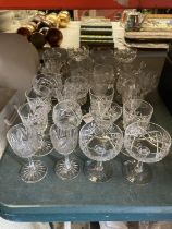 A QUANTITY OF CUT GLASSES TO INCLUDE SHERRY, COCKTAIL, TUMBLERS, PORT, ETC