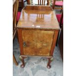 AN EARLY 20TH CENTURY WALNUT POT CUPBOARD ON CABRIOLE LEGS