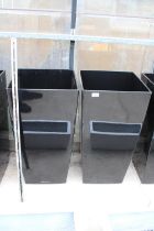 A PAIR OF TALL BLACK PLASTIC SQUARE PLANTERS (H:76CM W:40CM)