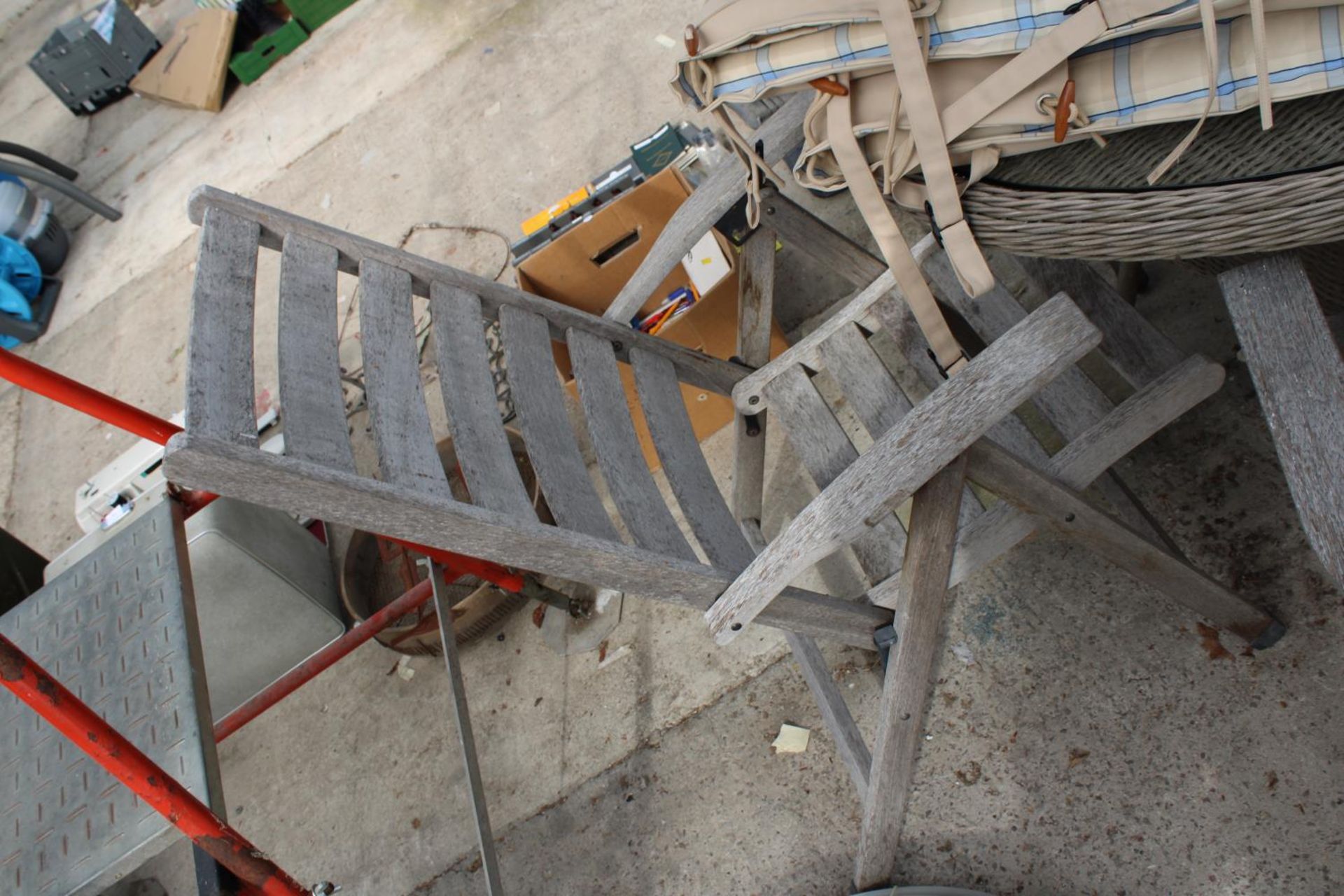 A RATTAN GARDEN TABLE WITH GLASS TOP, SIX FOLDING TEAK CHAIRS, CUSHIONS AND PARASOL WITH BASE - Image 4 of 4