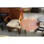 A RETRO TEAK McINTOSH CARVER CHAIR AND 28" DIAMETER FORMICA TOP COFFEE TABLE ON BLACK TAPERING LEGS