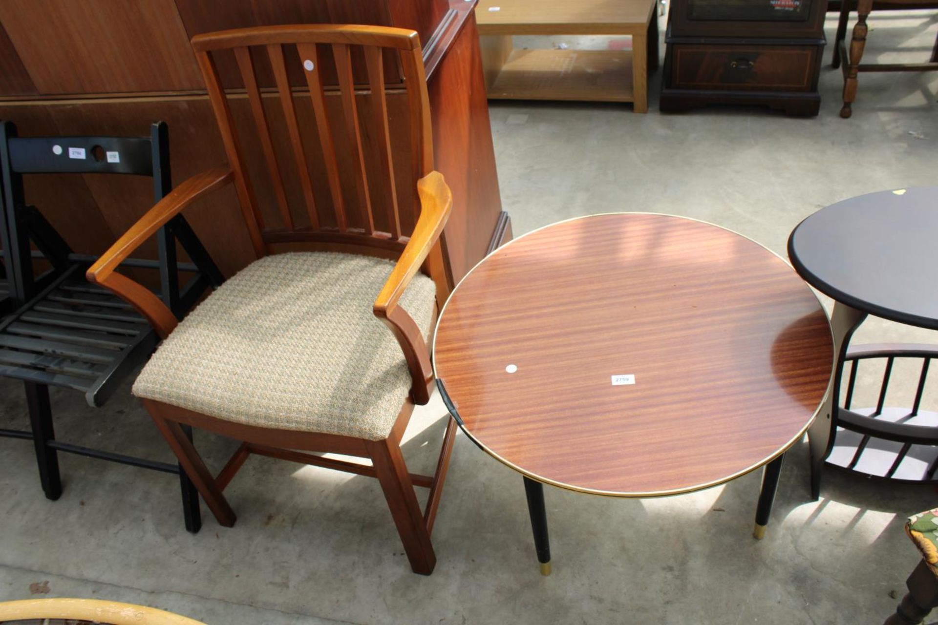 A RETRO TEAK McINTOSH CARVER CHAIR AND 28" DIAMETER FORMICA TOP COFFEE TABLE ON BLACK TAPERING LEGS