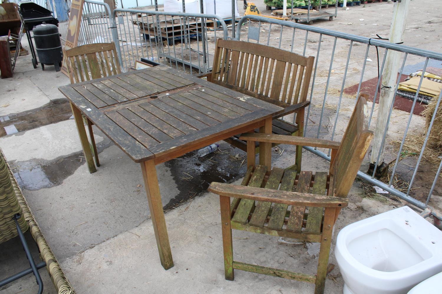 A TEAK GARDEN TABLE WITH A BENCH AND TWO CHAIRS - Image 6 of 6