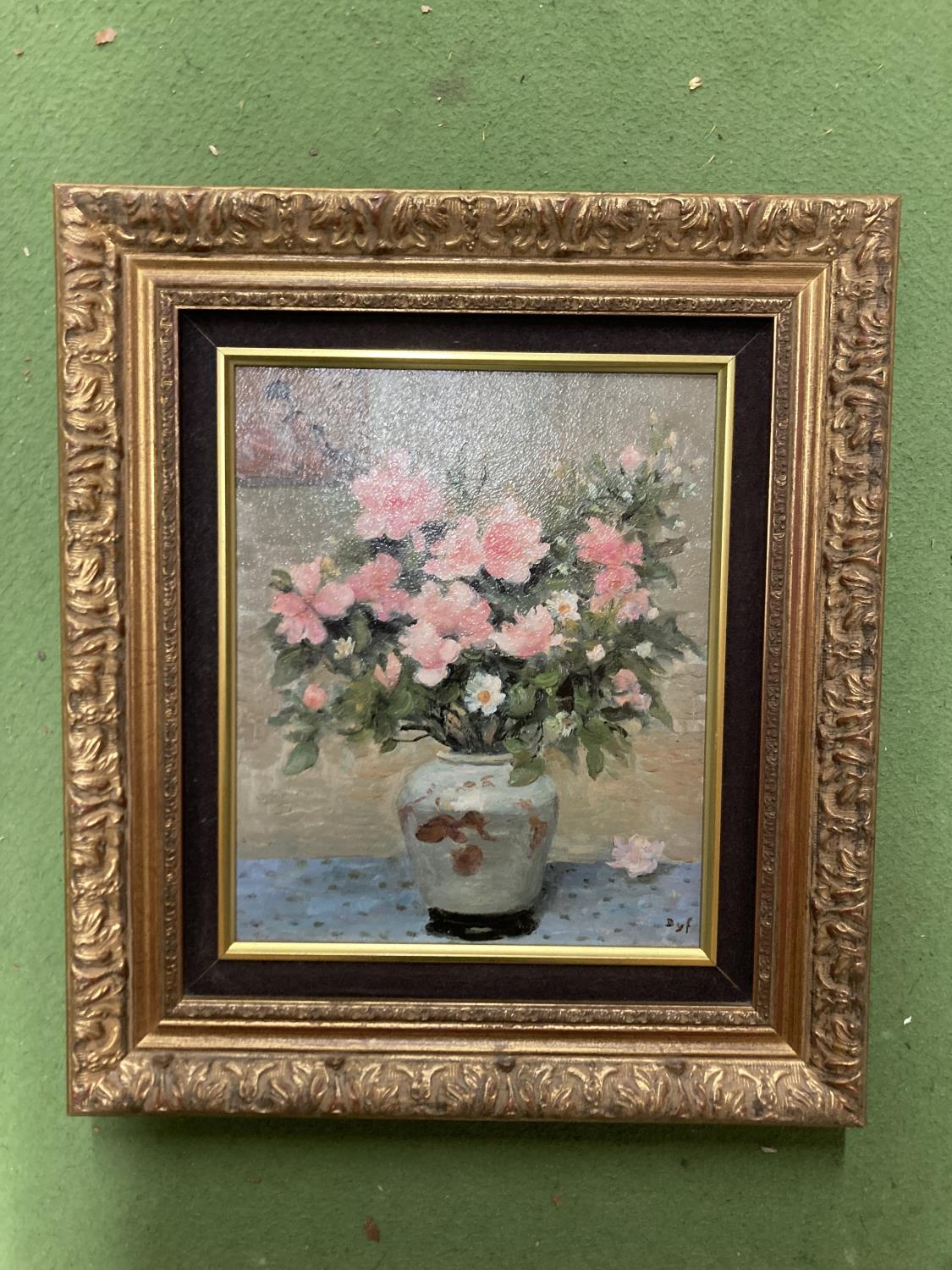 AN OIL ON BOARD STILL LIFE PAINTING OF FLOWERS