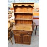 A PINE DRESSER WITH PLATE RACK, 29" WIDE