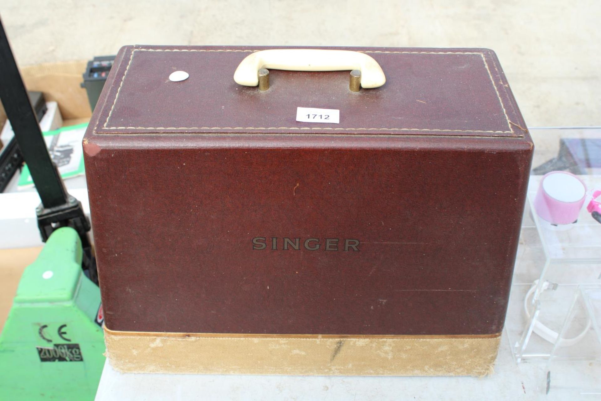 A RETRO SINGER SEWING MACHINE WITH CARRY CASE