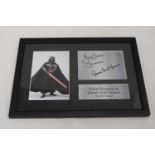 A SIGNED FRAMED PRINT OF DAVE PROWSE AND JAMES EARL JONES AS 'DARTH VADER'