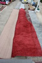 A BELIEVED AS NEW MADE IN TURKEY RED SHAGGY RUG (370CM x 460CM)