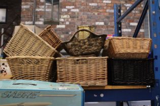 TWELVE WICKER BASKETS OF VARIOUS SHAPES AND SIZES