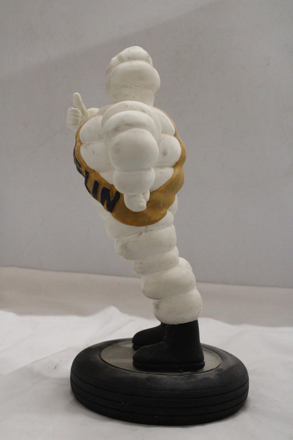 A VINTAGE ORIGINAL MICHELIN MAN ON TYRE APPROXIMATELY 33 CM HIGH - Image 3 of 5