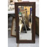 A VINTAGE MAHOGANY FRAMED MIRROR, WITH CARVED DETAIL AND BEVELLED GLASS, 44CM X 93CM