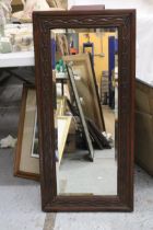A VINTAGE MAHOGANY FRAMED MIRROR, WITH CARVED DETAIL AND BEVELLED GLASS, 44CM X 93CM