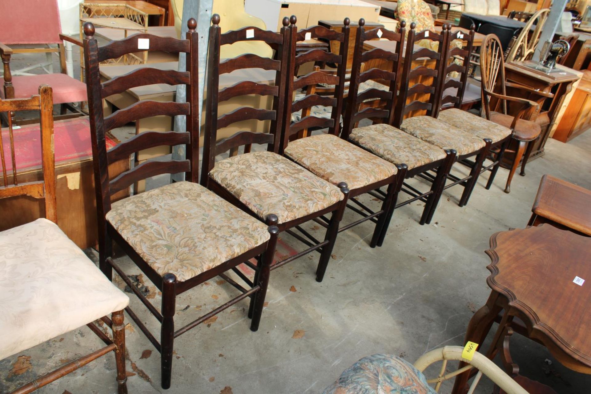 A SET OF SIX MODERN LADDER-BACK DINING CHAIRS