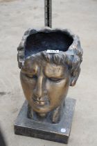 A LOW FIBRE GLASS GREEK GOD HEAD PLANTER