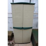 A TALL PLASTIC TWO DOOR GARDEN STORAGE SHED