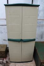 A TALL PLASTIC TWO DOOR GARDEN STORAGE SHED