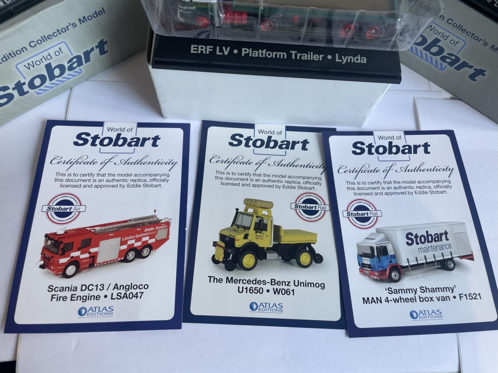 FOUR BOXED STOBART VEHICLES TO INCLUDE A UNIMOG, FIRE ENGINE AND TWO WAGONS THREE WITH COA - Image 6 of 7