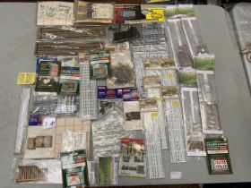 A LARGE COLLECTION OF RAILWAY ACCESSORIES TO INCLUDE MAINLY FENCING KITS, PALLETS, MAIL BAGS ETC.