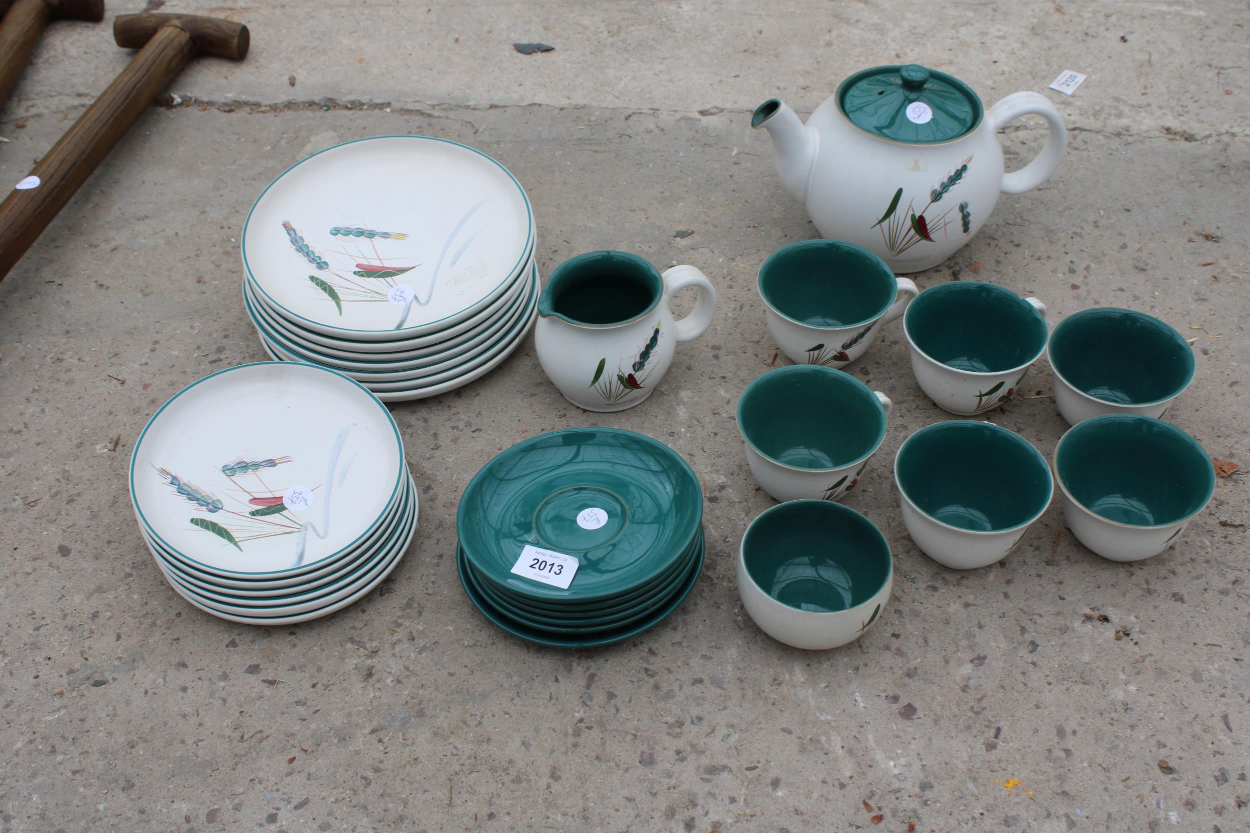 A RETRO DENBY DINNER SERVICE TO INCLUDE PLATES, CUPS AND SAUCERS AND TEAPOT ETC