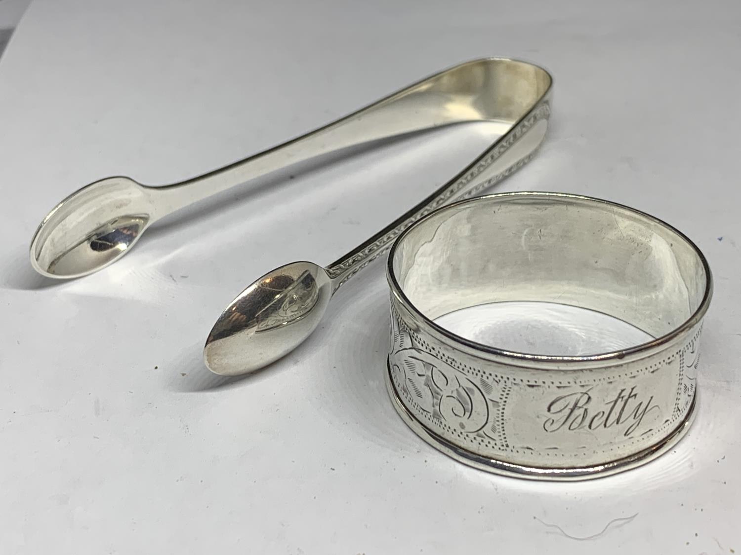 FOUR HALLMARKED SILVER ITEMS TO INCLUDE SHEFFIELD SUGAR NIPS AND THREE NAPKINS RINGS ONE BIRMINGHAM, - Image 2 of 7