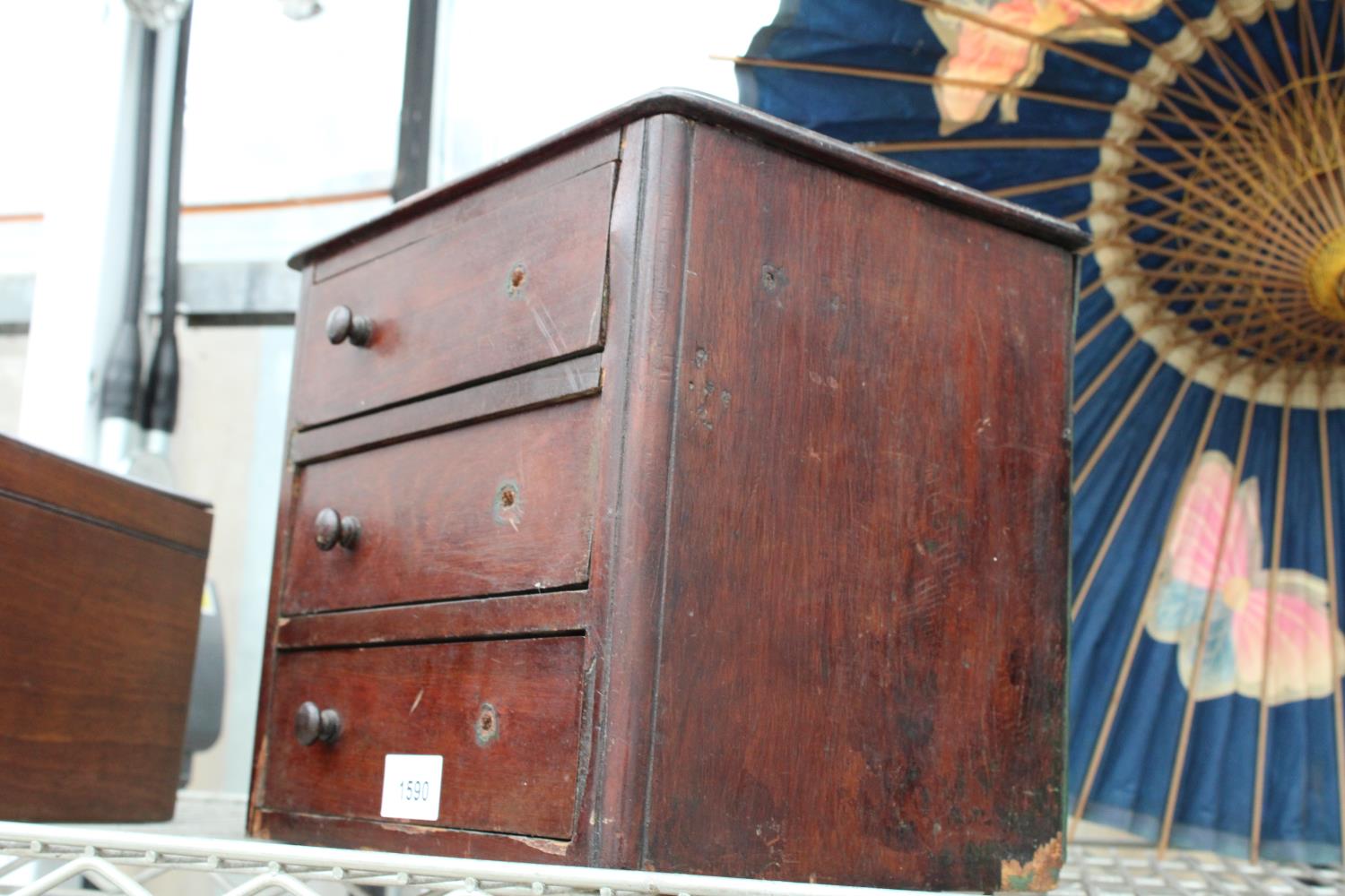 A VINTAGE SCRUMBLE PINE MINIATURE THREE DRAWER CHEST