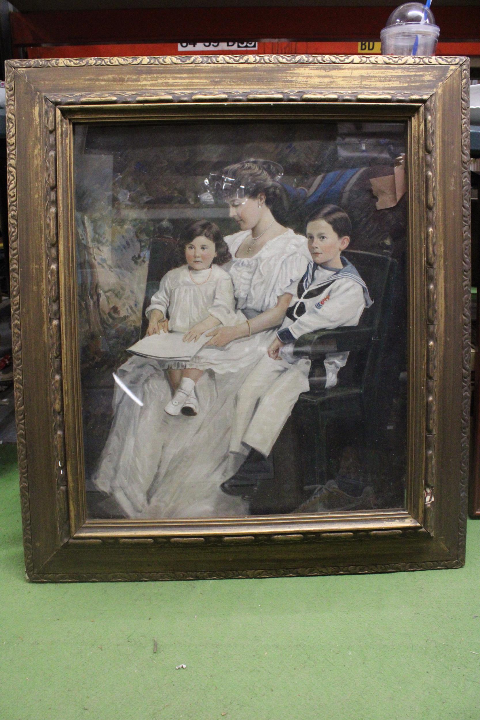 A LARGE VICTORIAN OIL ON CANVAS OF A MOTHER WITH CHILDREN, IN A GILT FRAME, 71CM X 82CM