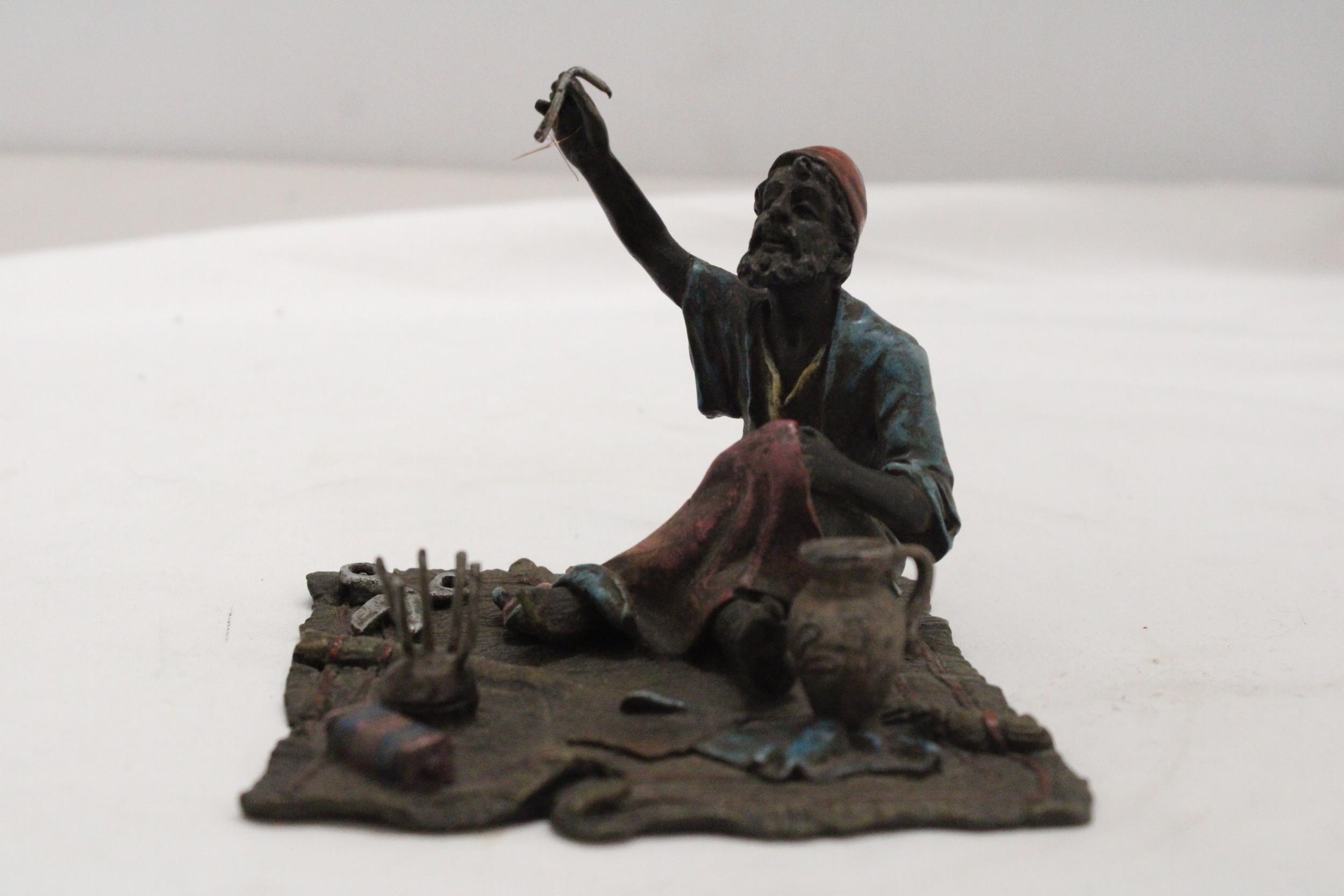 A COLD PAINTED BRONZE OF AN ARAB TAYLOR ON A RUG - Image 2 of 5