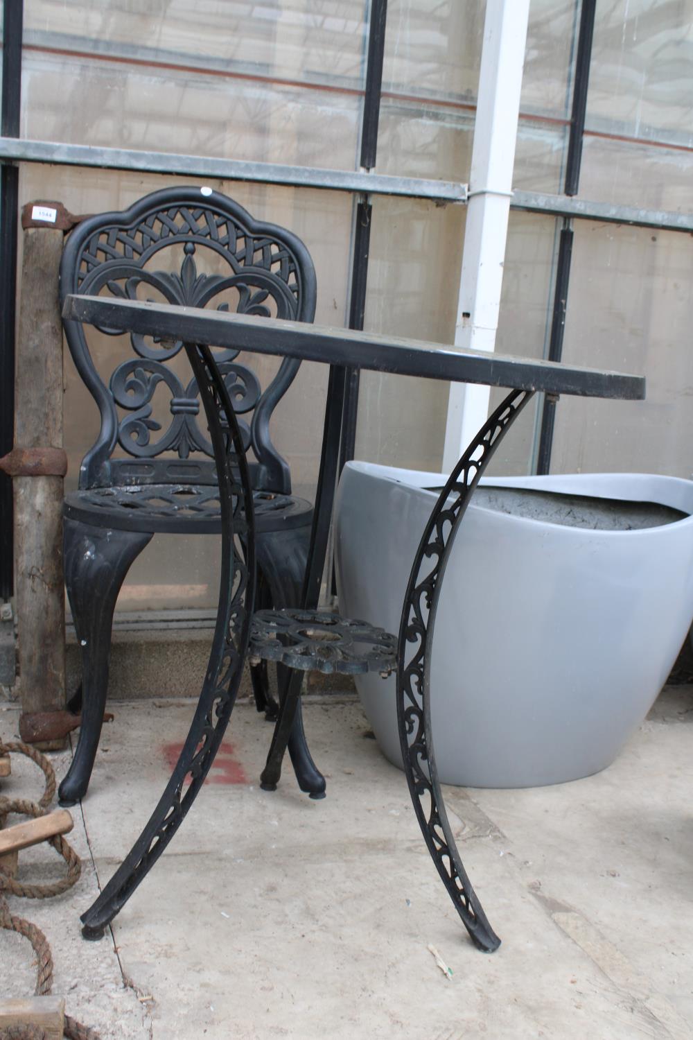 A GREEN PAINTED CAST ALLOY BISTRO TABLE AND SINGLE CHAIR - Image 2 of 2