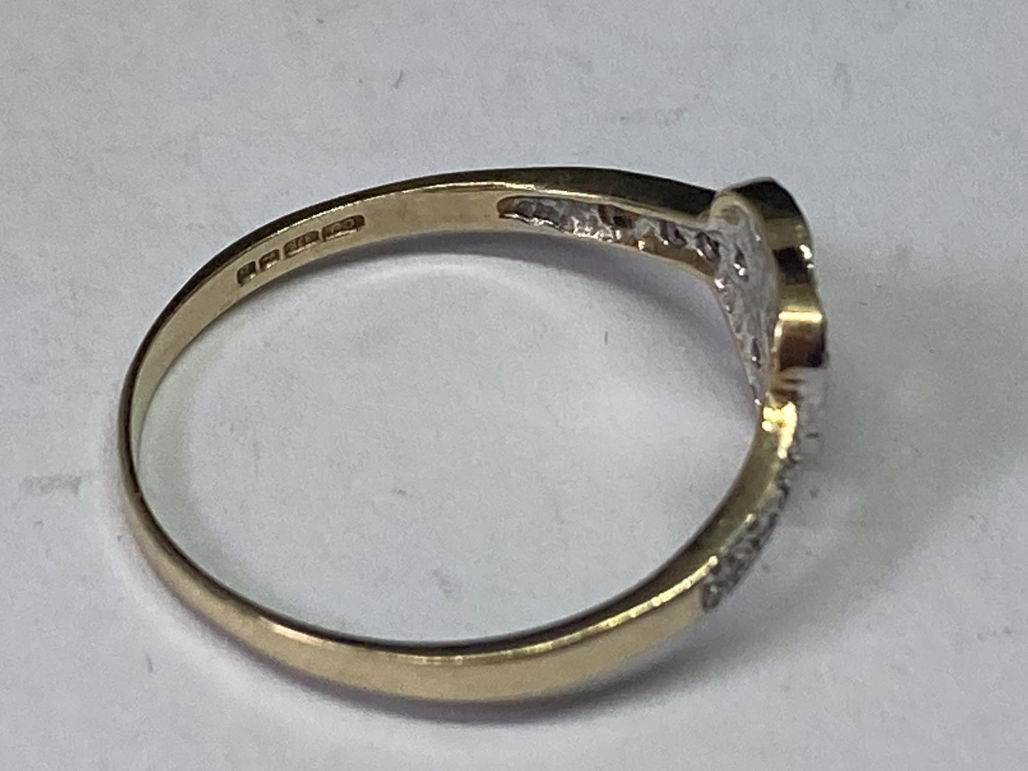A 9 CARAT GOLD RING WITH DIAMONDS IN A HEART DESIGN SIZE R - Image 2 of 3