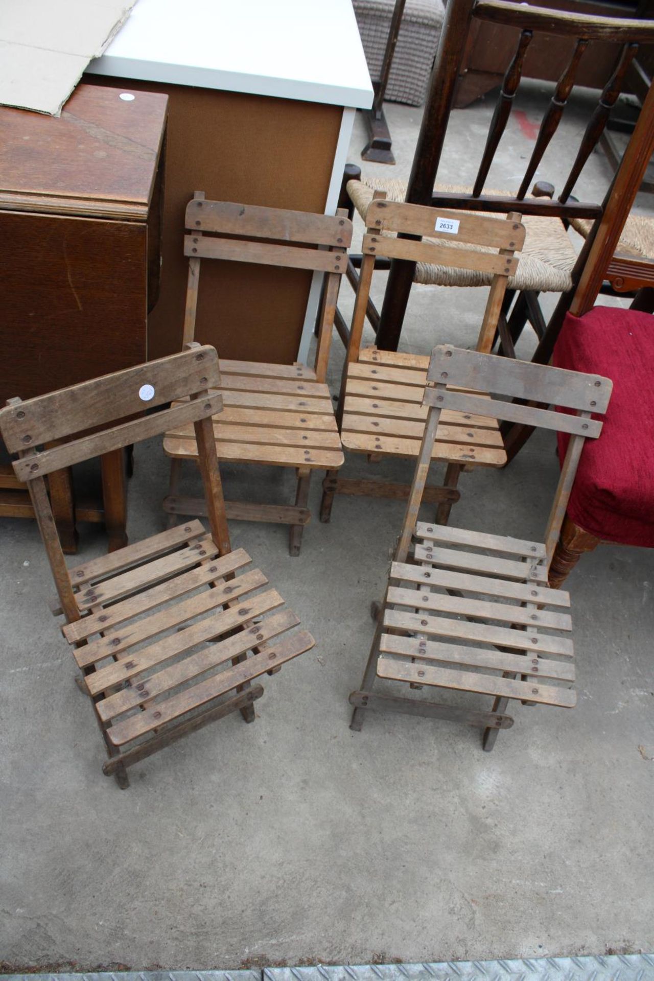 A SET OF FOUR EARLY 20TH CENTURY FOLDING CHILDS CHAIRS