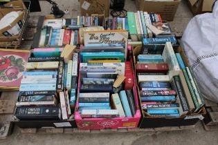 A LARGE ASSORTMENT OF BOOKS