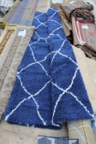 A BELIEVED AS NEW MADE IN TURKEY NAVY AND WHITE RUG (245CMx305CM)