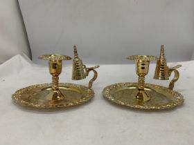 A PAIR OF SILVER PLATED CANDLESTICKS AND SNUFFERS