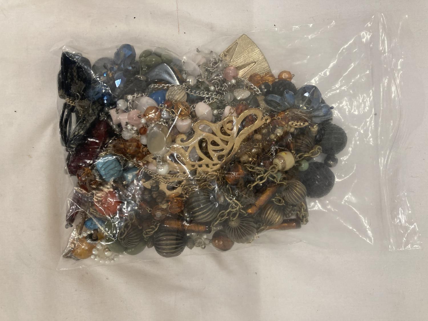 A BAG OF VINTAGE COSTUME JEWELLERY