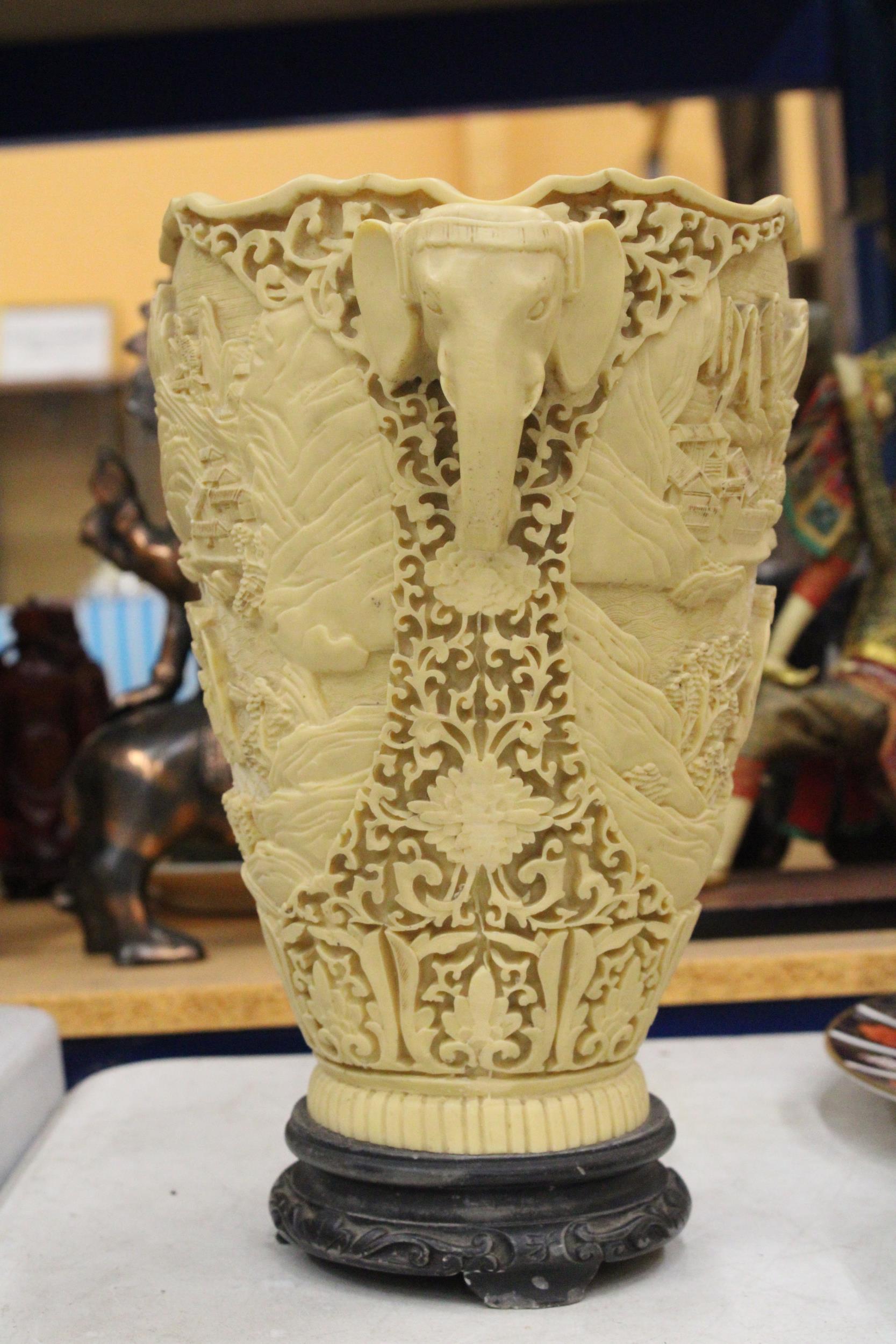 A LARGE CHINESE CARVED RESIN VASE WITH ELEPHANT HANDLES - Image 3 of 9