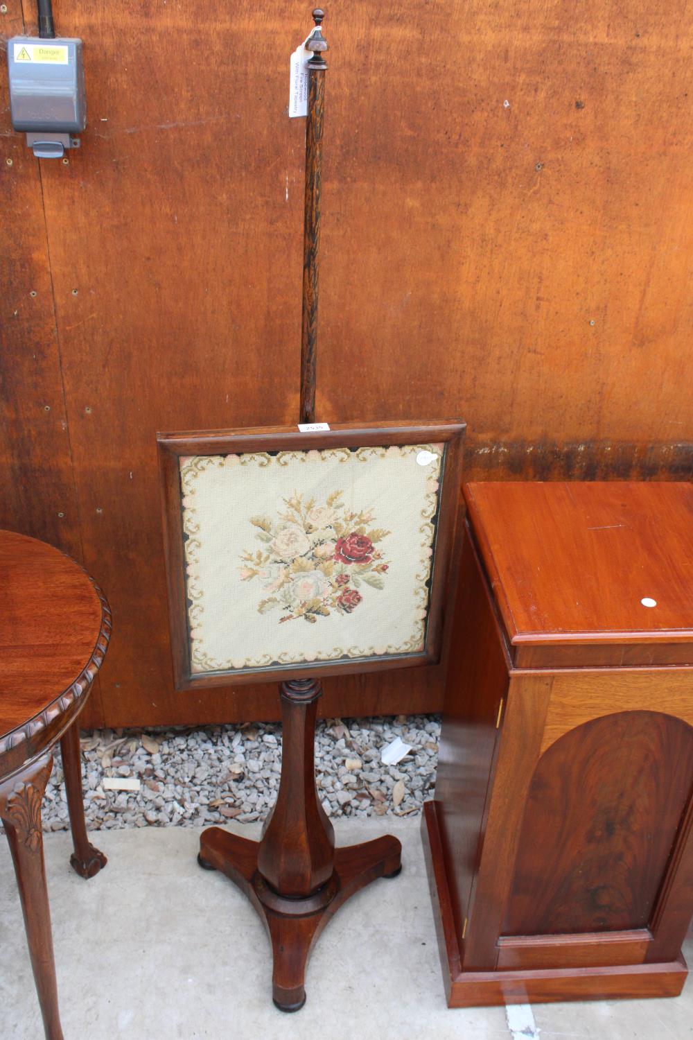 A VICTORIAN ROSEWOOD POLE SCREEN WITH INSET FLORAL WOOLWORK PANEL