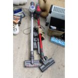 A DYSON STICK VACUUM AND A BELDRAY STICK VACUUM