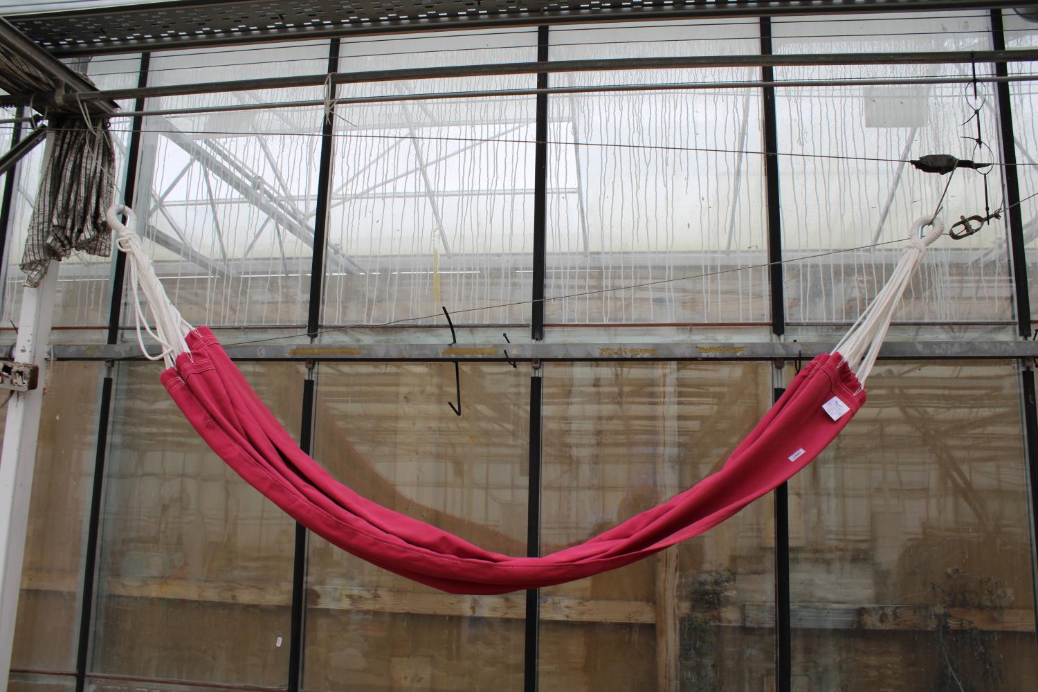 A PINK MATERIAL VIVERE HAMMOCK