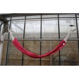 A PINK MATERIAL VIVERE HAMMOCK