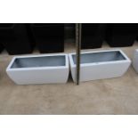 A PAIR OF WHITE LOW FIBRE GLASS TROUGH PLANTERS (H:20 L:49CM)