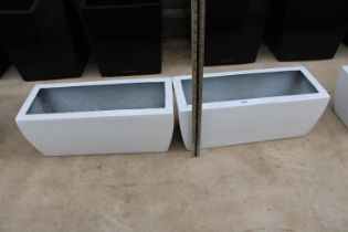 A PAIR OF WHITE LOW FIBRE GLASS TROUGH PLANTERS (H:20 L:49CM)