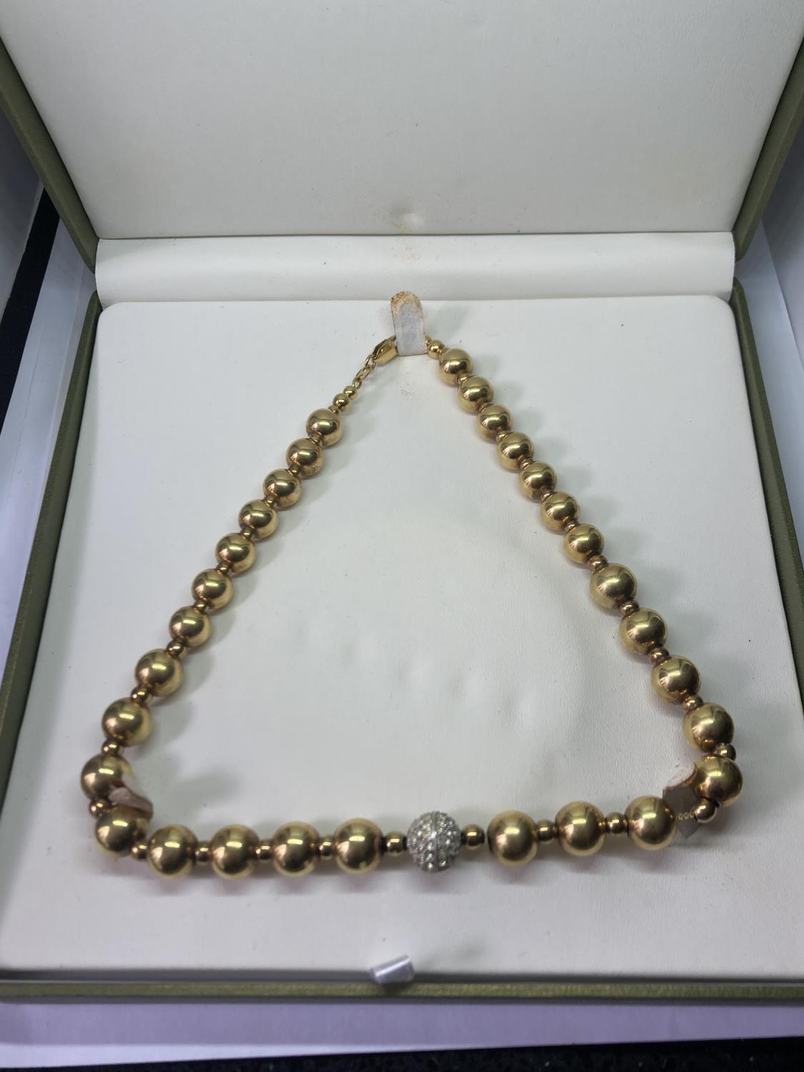 A 1980'S SILVER GILT SPHERE NECKLACE WITH DIAMANTE BALL IN A PRESENTATION BOX